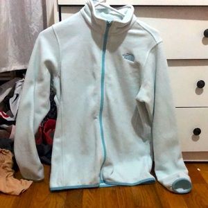 North face baby blue jacket. XL in girl size fits like a medium in womens.